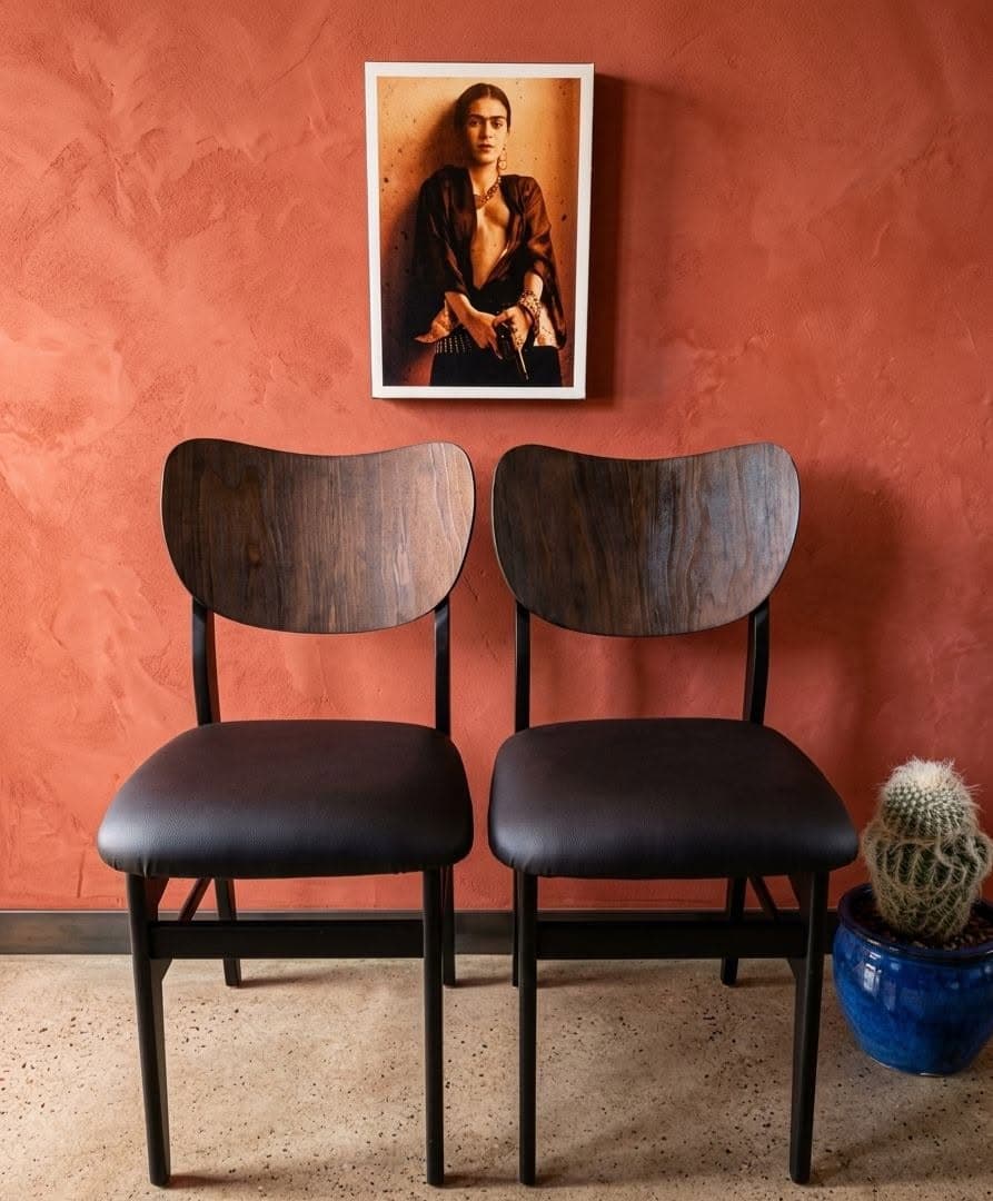 Refined Oak Dining Chairs (Pair) after restoration, matte black frames with dark Imbuia-stained veneer backrests and reupholstered faux leather seats